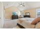 Bright main bedroom with a high ceiling, fan, television, dresser, and neutral color palette at 4316 Constellation Blvd, Snellville, GA 30039