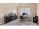 Bright office with a large window and modern desk setup, perfect for working from home at 4316 Constellation Blvd, Snellville, GA 30039