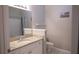 Bathroom features a single sink vanity with a granite countertop and mirror at 101 Spring Heights Se Ln # 1, Smyrna, GA 30080