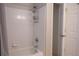Clean bathroom with a combined shower and tub with tile walls and a shower curtain at 101 Spring Heights Se Ln # 1, Smyrna, GA 30080