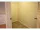 Walk-in closet with carpeted floor and a light, near a finished room at 101 Spring Heights Se Ln # 1, Smyrna, GA 30080