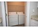 Functional laundry room with side-by-side washer and dryer at 101 Spring Heights Se Ln # 1, Smyrna, GA 30080
