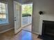 Living room access to private patio with white railing, and view of the outdoors at 101 Spring Heights Se Ln # 1, Smyrna, GA 30080