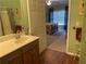 Inviting bathroom offering a sink vanity with views into a bedroom at 119 Holiday Rd # 704, Buford, GA 30518