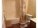 Bright bathroom featuring a shower/tub combination and floral patterned shower curtain at 119 Holiday Rd # 704, Buford, GA 30518