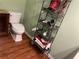 Neutral bathroom with wooden floor and metal shelving at 119 Holiday Rd # 704, Buford, GA 30518
