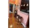 Kitchen counter with barstool seating, granite countertops, and pendant lighting at 119 Holiday Rd # 704, Buford, GA 30518