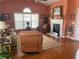 Bright living room boasting hardwood floors, a fireplace, a comfortable seating arrangement, and natural light at 119 Holiday Rd # 704, Buford, GA 30518