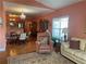 Inviting living room featuring hardwood floors, a plush sofa, a leather recliner, and access to kitchen area at 119 Holiday Rd # 704, Buford, GA 30518