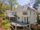 Exterior rear of home with tiered deck and screened in porch at 129 Ridgetree Ln, Marietta, GA 30068