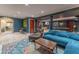 Basement showcasing an open layout with a cozy lounge area and a game area, with hardwood floors at 129 Ridgetree Ln, Marietta, GA 30068