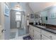 Bright bathroom featuring a vanity with a dark countertop and a shower/tub combination at 129 Ridgetree Ln, Marietta, GA 30068
