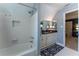 Bathroom featuring vanity, a shower/tub combination, and neutral walls, door leading to bedroom at 129 Ridgetree Ln, Marietta, GA 30068