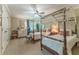 Bedroom with two beds and neutral walls, a ceiling fan, and decor, with curtains and a small desk at 129 Ridgetree Ln, Marietta, GA 30068