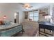 Cozy bedroom with built-in bookshelves, window seat, and a comfortable daybed with a desk in the corner at 129 Ridgetree Ln, Marietta, GA 30068