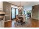 Bright breakfast nook with chandelier, hardwood floors, and access to screened porch at 129 Ridgetree Ln, Marietta, GA 30068