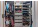 Organized walk-in closet with custom shelving, drawers, and ample hanging space for clothes and accessories at 129 Ridgetree Ln, Marietta, GA 30068