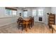 Dining table with seating and natural light from nearby windows and doors at 129 Ridgetree Ln, Marietta, GA 30068