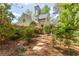 Charming home exterior showcasing meticulous landscaping, a stone walkway, and blooming flowers at 129 Ridgetree Ln, Marietta, GA 30068