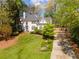 Beautiful home featuring a manicured lawn and a well-maintained landscape at 129 Ridgetree Ln, Marietta, GA 30068