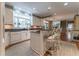 Bright kitchen with an island, white cabinets, and updated appliances at 129 Ridgetree Ln, Marietta, GA 30068
