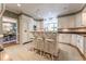Open kitchen featuring an island with bar seating, white cabinetry, and modern fixtures at 129 Ridgetree Ln, Marietta, GA 30068