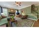Cozy living room featuring hardwood floors, a fireplace, and staircase access at 129 Ridgetree Ln, Marietta, GA 30068