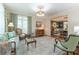 Inviting living room with elegant furnishings, large windows, and open access to the dining room at 129 Ridgetree Ln, Marietta, GA 30068