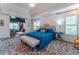 Bright bedroom with a tray ceiling, ornate rug, and seating area at 129 Ridgetree Ln, Marietta, GA 30068
