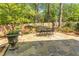 Secluded flagstone patio featuring a dining set, surrounded by greenery and landscaping at 129 Ridgetree Ln, Marietta, GA 30068