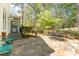 Beautiful flagstone patio with table, chairs, and landscaped surroundings, perfect for outdoor enjoyment at 129 Ridgetree Ln, Marietta, GA 30068