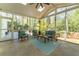 Inviting screened porch with ample seating and views of a lush, wooded landscape at 129 Ridgetree Ln, Marietta, GA 30068