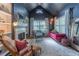 Sitting area with a fireplace, natural light, and unique decor at 129 Ridgetree Ln, Marietta, GA 30068