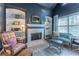 Sitting area with a fireplace, custom shelving, and unique decor at 129 Ridgetree Ln, Marietta, GA 30068