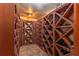Wine cellar featuring custom built wooden wine racks and tiled floor at 129 Ridgetree Ln, Marietta, GA 30068