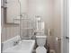 Bathroom with neutral-colored walls, a vanity, a toilet, and a rack at 566 Huff St, Lawrenceville, GA 30046