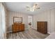 Bedroom with wood-look flooring and neutral-colored walls at 566 Huff St, Lawrenceville, GA 30046