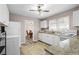 Open kitchen with white cabinets and wood-look flooring, with dining room access at 566 Huff St, Lawrenceville, GA 30046