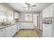Efficient kitchenette includes bright cabinets and countertops, plus modern appliances at 566 Huff St, Lawrenceville, GA 30046
