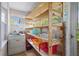 Laundry room with shelving, storage containers, and vintage washer at 566 Huff St, Lawrenceville, GA 30046
