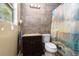 Bathroom features a tiled shower, modern vanity, and decorative lighting at 1302 Brittain Rd, Douglasville, GA 30134