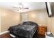 Comfortable bedroom with hardwood floors, natural lighting, and modern ceiling fan at 1302 Brittain Rd, Douglasville, GA 30134