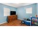 Bedroom with laminate wood floor and tv at 1302 Brittain Rd, Douglasville, GA 30134
