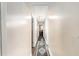 Bright hallway with neutral walls, a decorative runner, and hardwood flooring at 1302 Brittain Rd, Douglasville, GA 30134