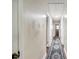 Bright hallway with hardwood floors, a patterned rug, and neutral-toned walls at 1302 Brittain Rd, Douglasville, GA 30134