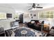 Open-concept living area featuring a cozy seating area and backyard views at 1302 Brittain Rd, Douglasville, GA 30134