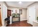Cozy room with hardwood floors, a fish tank, and a decorative bookshelf at 1302 Brittain Rd, Douglasville, GA 30134
