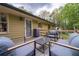 Backyard deck with outdoor seating offering views of the home and surrounding yard at 284 Zion Wood Rd, Loganville, GA 30052