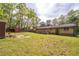 The expansive yard features a shed, offering ample space for outdoor activities and storage at 284 Zion Wood Rd, Loganville, GA 30052