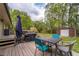 Backyard with a deck, a table and chairs, and a storage shed at 284 Zion Wood Rd, Loganville, GA 30052